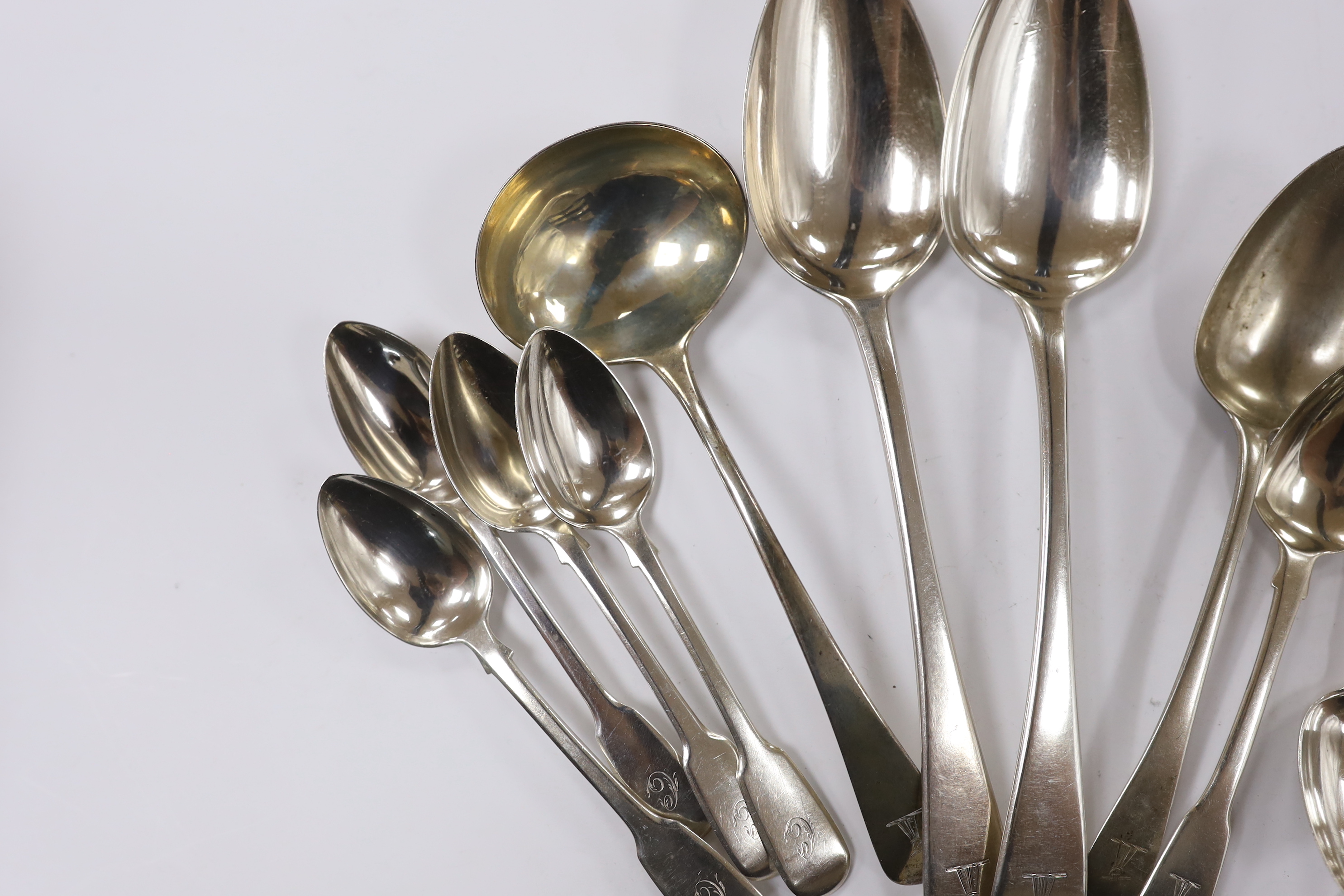 Fourteen assorted 19th century silver spoons, including table, tea and condiment and part of another silver spoons, 12.2oz.